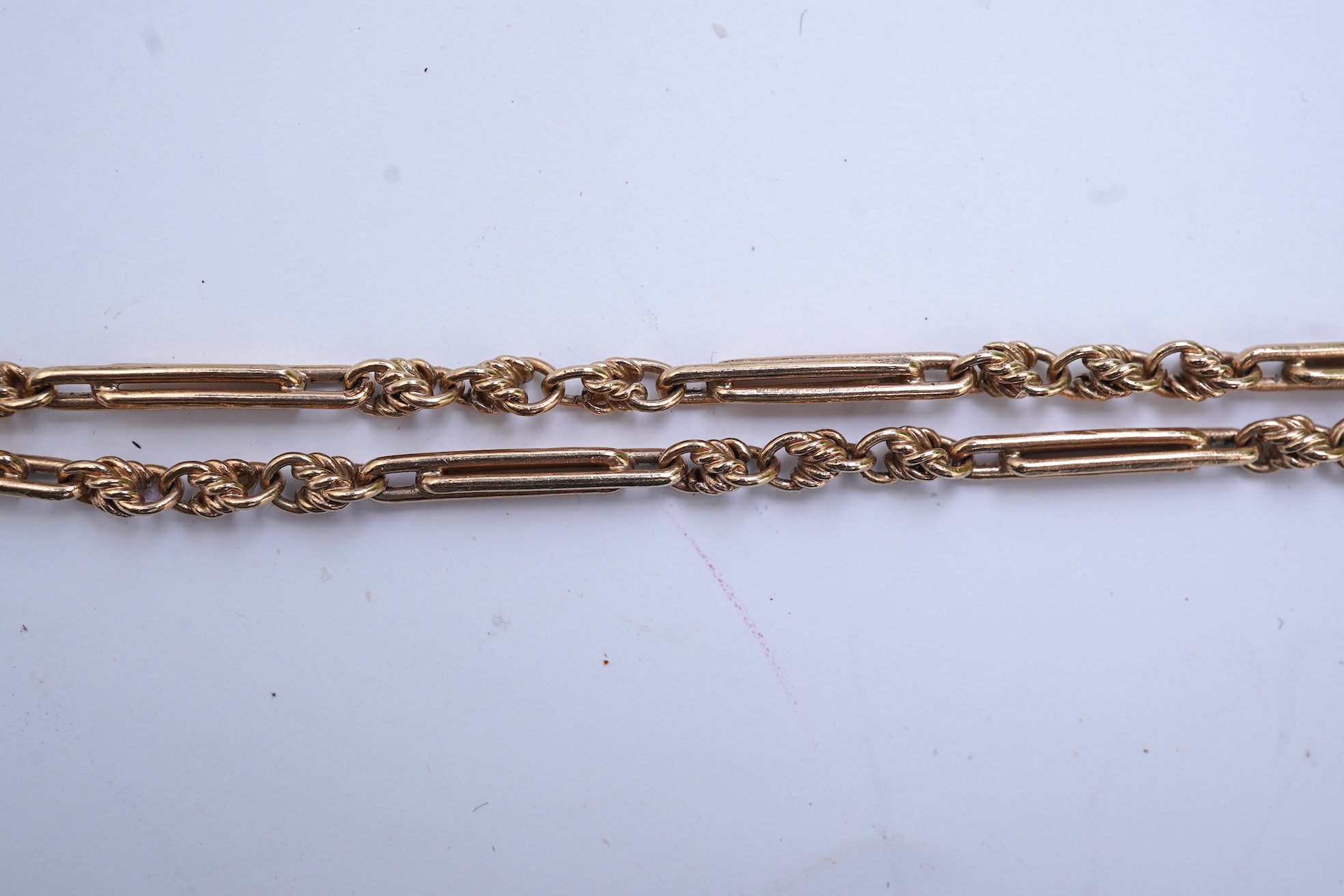 An amethyst fob seal, a gold Albert chain, and a pocket watch